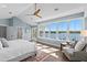 Airy main bedroom offers a stunning view, a ceiling fan, and an open, relaxing atmosphere at 2903 Pass A Grille Way, St Pete Beach, FL 33706