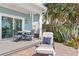This home has a lovely outdoor patio with comfortable seating, perfect for relaxing and enjoying the weather at 2903 Pass A Grille Way, St Pete Beach, FL 33706