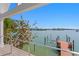 Breathtaking water view from the deck showcases lush landscaping and private dock at 2903 Pass A Grille Way, St Pete Beach, FL 33706
