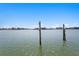 Waterfront with wooden poles at 2903 Pass A Grille Way, St Pete Beach, FL 33706