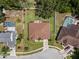 Aerial view of home with a big backyard, including an outdoor kitchen and sitting area with firepit at 3041 Colonial Ridge Dr, Brandon, FL 33511