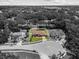 Aerial view of home and surrounding neighborhood with mature trees in a quiet suburb at 3041 Colonial Ridge Dr, Brandon, FL 33511