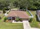 Aerial shot of a well-maintained house with a fenced backyard, green lawn, and a storage shed at 3041 Colonial Ridge Dr, Brandon, FL 33511