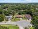 Aerial view of home and surrounding neighborhood with mature trees in a quiet suburb at 3041 Colonial Ridge Dr, Brandon, FL 33511