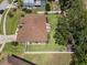 Aerial view of house featuring a spacious, fenced backyard with a cozy patio seating area and manicured lawn at 3041 Colonial Ridge Dr, Brandon, FL 33511