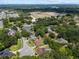 Aerial view showcases home in neighborhood with mature trees in a quiet suburb at 3041 Colonial Ridge Dr, Brandon, FL 33511