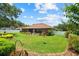 Enjoy the expansive backyard with lush lawn and charming patio, perfect for outdoor living at 3041 Colonial Ridge Dr, Brandon, FL 33511