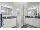 Modern bathroom featuring dual vanities, a glass-enclosed shower, and elegant finishes at 3041 Colonial Ridge Dr, Brandon, FL 33511
