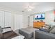 Bedroom featuring neutral walls, ceiling fan, dresser, and a comfy couch at 3041 Colonial Ridge Dr, Brandon, FL 33511