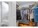 Organized walk-in closet with custom shelving and hanging rods, offering storage solutions at 3041 Colonial Ridge Dr, Brandon, FL 33511