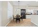 Cozy kitchen nook with a round table and updated appliances for comfortable dining at 3041 Colonial Ridge Dr, Brandon, FL 33511