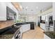 Modern kitchen with granite countertops, stainless steel appliances, and backyard view at 3041 Colonial Ridge Dr, Brandon, FL 33511