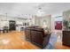 Spacious living room showcases hardwood floors, a large sectional, and an open layout connecting to the kitchen at 3041 Colonial Ridge Dr, Brandon, FL 33511