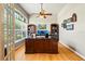 Bright home office boasts built-in bookcases, a large window, and plenty of workspace with a large executive desk at 3041 Colonial Ridge Dr, Brandon, FL 33511