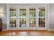 French doors leading to a sunroom or patio, showcasing the indoor-outdoor living at 3041 Colonial Ridge Dr, Brandon, FL 33511