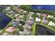An aerial view of a community with mature trees and several homes with private pools on large lots along a lake at 3123 Whitehead Ln, Land O Lakes, FL 34638