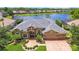 Beautiful lakefront home with mature landscaping, paver driveway, and neutral color palette in a desirable neighborhood at 3123 Whitehead Ln, Land O Lakes, FL 34638