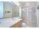 Clean bathroom featuring neutral tile and glass shower at 3123 Whitehead Ln, Land O Lakes, FL 34638