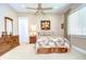 Well-lit bedroom featuring neutral colors, carpet flooring, and a light-colored ceiling fan at 3123 Whitehead Ln, Land O Lakes, FL 34638