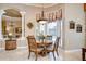 Bright breakfast nook with large window and decorative chandelier at 3123 Whitehead Ln, Land O Lakes, FL 34638
