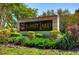 Attractive Sunset Lakes community entrance sign surrounded by lush landscaping and mature trees on a sunny day at 3123 Whitehead Ln, Land O Lakes, FL 34638