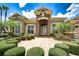 Charming home with manicured lawn, mature palms and brick paver driveway and entry in a gated community at 3123 Whitehead Ln, Land O Lakes, FL 34638