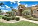 Charming home with manicured lawn, mature palms and brick paver driveway and entry in a gated community at 3123 Whitehead Ln, Land O Lakes, FL 34638