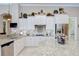 A gourmet kitchen with granite countertops, custom cabinetry, and stainless steel appliances at 3123 Whitehead Ln, Land O Lakes, FL 34638