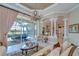 Open-concept living space connects indoor living with an outdoor screened lanai at 3123 Whitehead Ln, Land O Lakes, FL 34638