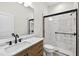 Modern bathroom featuring stylish vanity, marble enclosed shower and tiled floor at 33487 Azalea Ridge Dr, Wesley Chapel, FL 33545