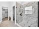 Luxurious bathroom featuring a glass enclosed shower, walk-in closet and stylish tile flooring at 33487 Azalea Ridge Dr, Wesley Chapel, FL 33545