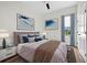 Comfortable bedroom featuring bed, dark wood floor and natural light at 33487 Azalea Ridge Dr, Wesley Chapel, FL 33545