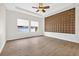 Spacious bedroom features paneled wall, ceiling fan and windows providing natural light at 33487 Azalea Ridge Dr, Wesley Chapel, FL 33545