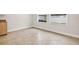 The room has light tile flooring, white trim, white walls, and windows looking out at a white fence at 33487 Azalea Ridge Dr, Wesley Chapel, FL 33545