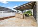 A spacious patio with outdoor seating, dining area, and grilling station, ideal for relaxation and gatherings at 33487 Azalea Ridge Dr, Wesley Chapel, FL 33545