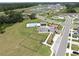 Aerial view of community amenities featuring a pool, playground, and dog park at 35552 Shade Fern Ln, Zephyrhills, FL 33541