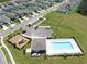 Community amenities include a sparkling pool, playground, and dog park, surrounded by lush landscaping at 35552 Shade Fern Ln, Zephyrhills, FL 33541