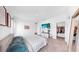 Inviting bedroom with carpet flooring and a flat screen TV mounted on the wall at 35552 Shade Fern Ln, Zephyrhills, FL 33541