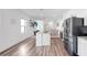 Modern kitchen with island, stainless steel appliances, and open floor plan at 35552 Shade Fern Ln, Zephyrhills, FL 33541