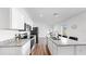 Modern kitchen with granite countertops, stainless steel appliances, and ample cabinet space at 35552 Shade Fern Ln, Zephyrhills, FL 33541