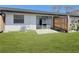 Home backyard with green lawn and wooden fence at 366 47Th N Ave # 3, St Petersburg, FL 33703