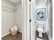 Compact bathroom featuring a walk-in shower, contemporary toilet, and a small storage space at 366 47Th N Ave # 3, St Petersburg, FL 33703