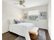 Cozy bedroom with a ceiling fan, plush rug, natural light from the window, and serene wall decor at 366 47Th N Ave # 3, St Petersburg, FL 33703