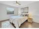 Well-lit bedroom with a ceiling fan, neutral tones, decorative lamps, and inviting decor at 366 47Th N Ave # 3, St Petersburg, FL 33703
