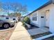 Charming exterior of home featuring a front door, window, and walkway, with a car parked in front at 366 47Th N Ave # 3, St Petersburg, FL 33703