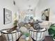 Open living room and dining area, showcasing modern decor, a cozy seating arrangement and natural light at 366 47Th N Ave # 3, St Petersburg, FL 33703