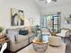 Comfortable living room with elegant decor, plush seating, and easy access to a private outdoor area at 366 47Th N Ave # 3, St Petersburg, FL 33703