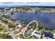 Waterfront property featuring a private dock and lush tropical landscaping on a serene bay at 3800 Shore Acres Ne Blvd, St Petersburg, FL 33703