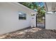 Charming courtyard with brick paving, privacy wall, and gated access at 3800 Shore Acres Ne Blvd, St Petersburg, FL 33703