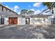 Contemporary home featuring a private courtyard entrance and a two-car garage at 3800 Shore Acres Ne Blvd, St Petersburg, FL 33703
